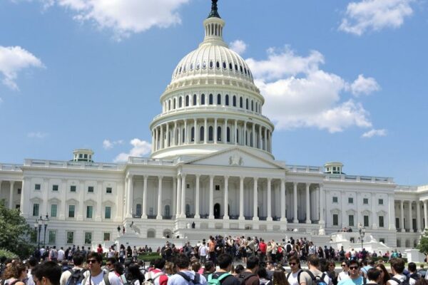 Young adults with backpacks near U.S. Capitol building