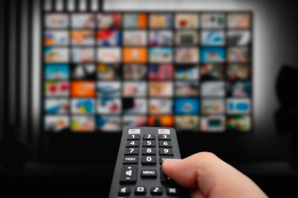 remote pointed at TV picking TV show
