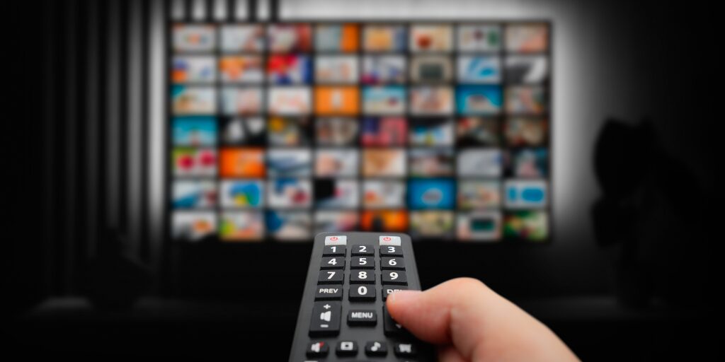 remote pointed at TV picking TV show
