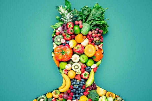 Fresh foods and human silhouette with calming blue background.