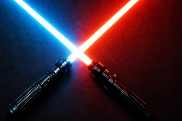 Exploring the Galaxy Far, Far Away: Star Wars Timeline Deep Dive Two lightsabers, one glowing blue and the other red—cross at their centers against a dark, textured background, with vivid light radiating from each blade