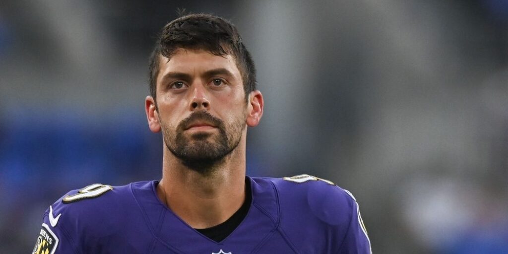 Justin Tucker in a Ravens uniform on the field.